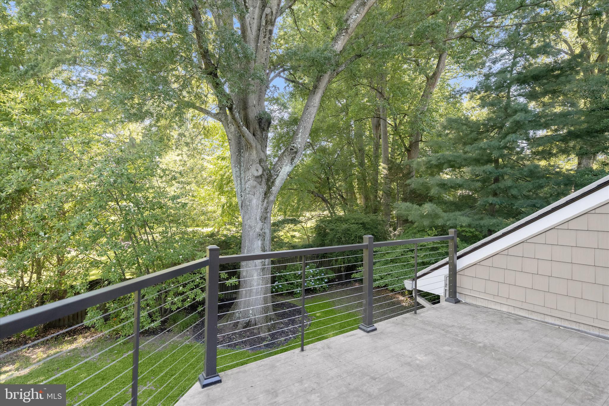 5104 Scarsdale Road Bethesda, MD 20816 - Photo 43 of 68 a view of a balcony with trees