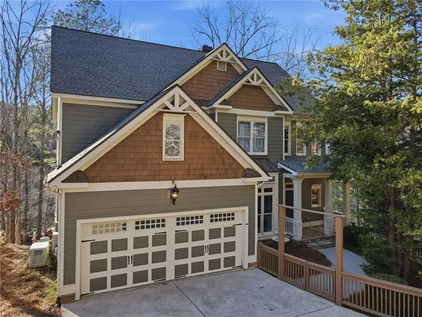 a front view of a house with a garage