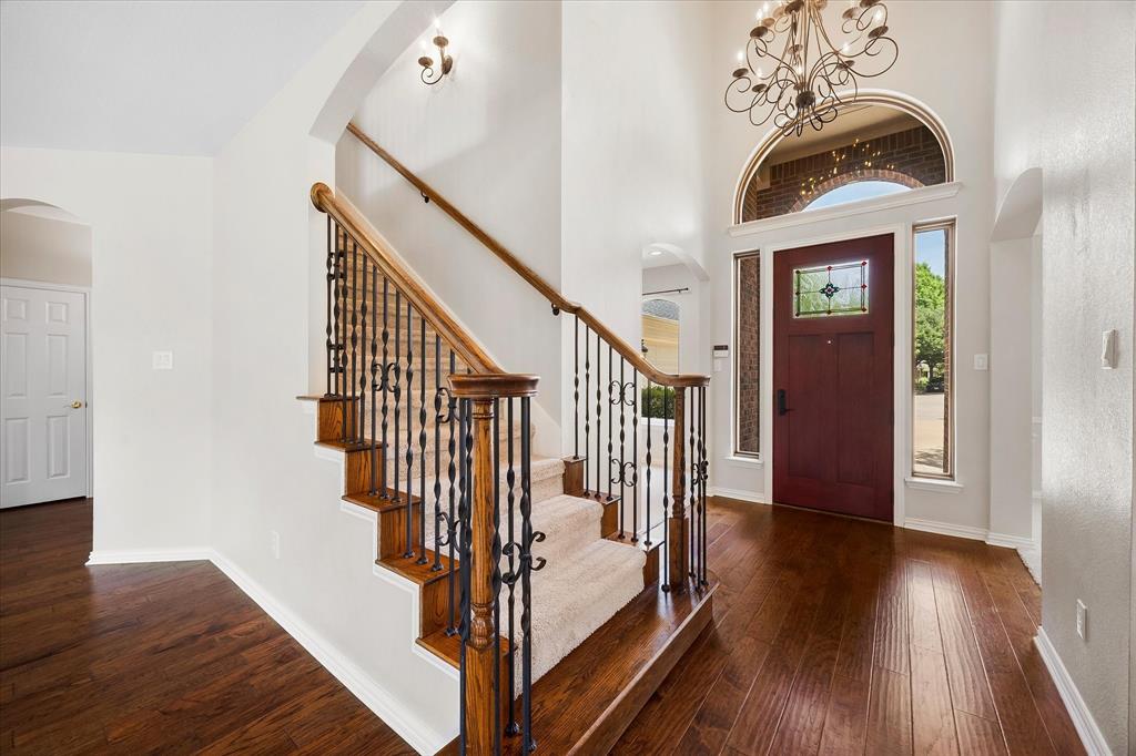 645 Channel Ridge Drive Rockwall, TX 75087 - Photo 6 of 40 A soaring 2-story ceiling and showstopping chandelier welcome your guests.