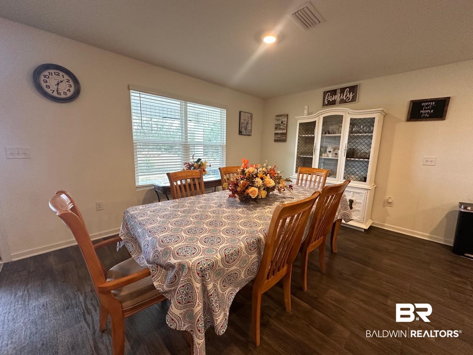 23792 Unbridled Loop Daphne, AL 36526 - Photo 12 of 36 Dining space featuring dark wood-style floors and baseboards
