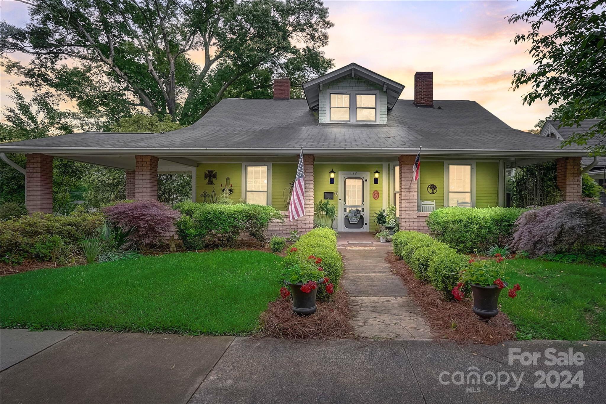 179 Union Street South Concord, NC 28025 - Photo 1 of 38 a front view of a house with garden