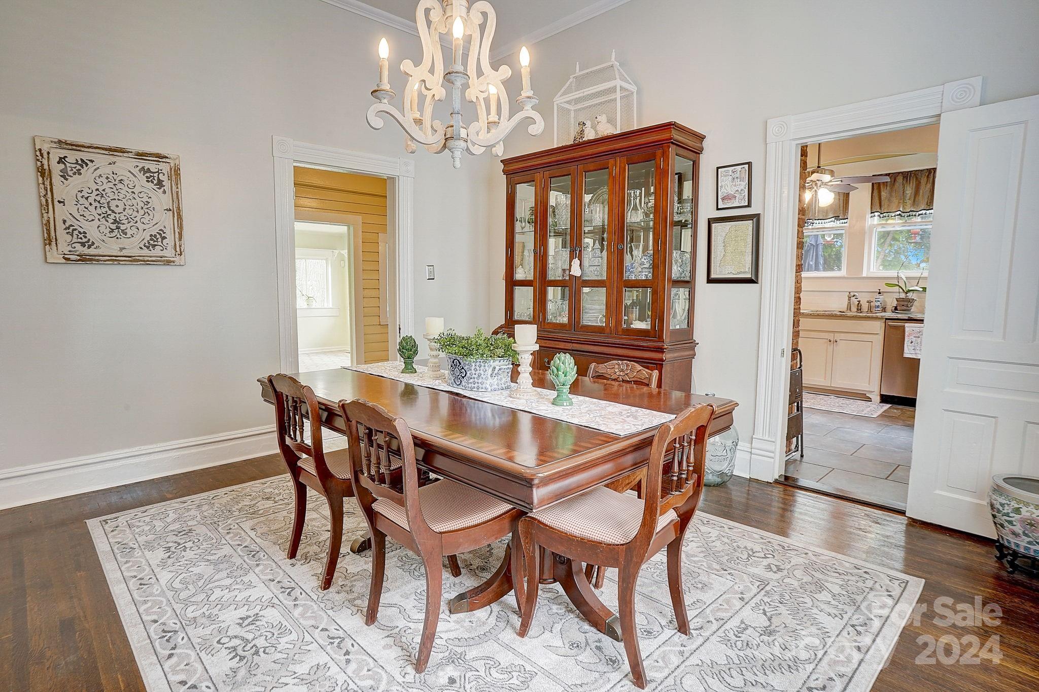 179 Union Street South Concord, NC 28025 - Photo 12 of 38 a dining room with furniture a rug and a chandelier