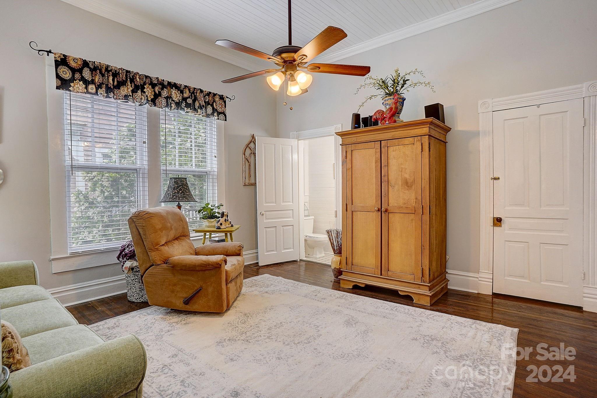 179 Union Street South Concord, NC 28025 - Photo 21 of 38 a living room with furniture a chandelier and a window