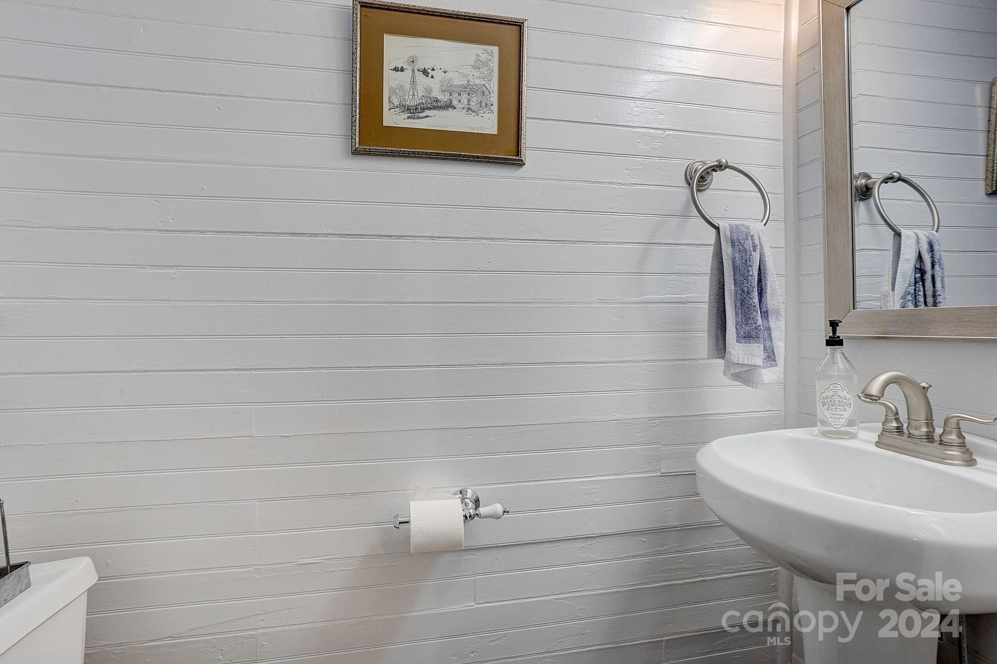179 Union Street South Concord, NC 28025 - Photo 22 of 38 a bathroom with a sink and a mirror