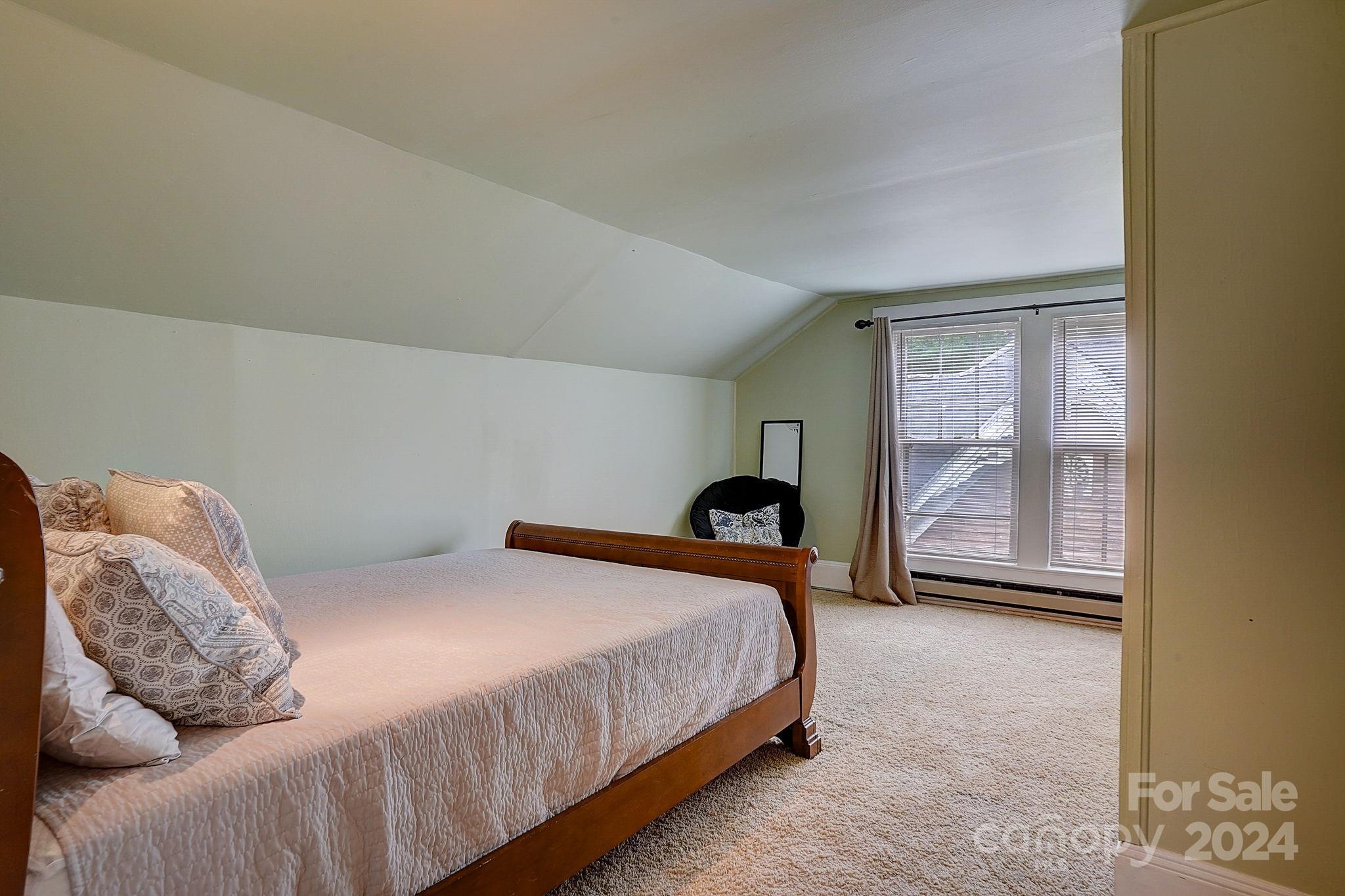 179 Union Street South Concord, NC 28025 - Photo 25 of 38 a bedroom with a bed and a window