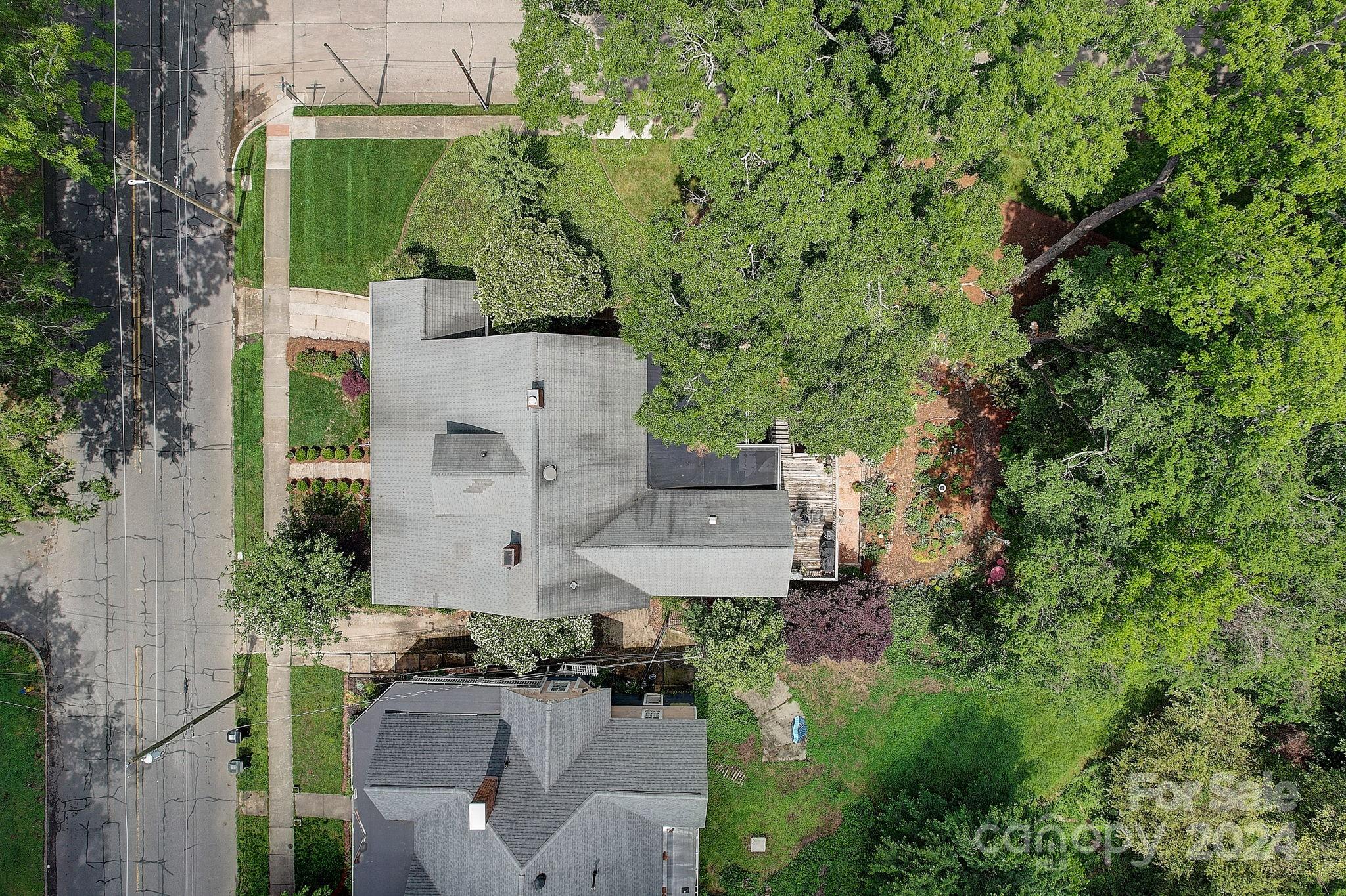 179 Union Street South Concord, NC 28025 - Photo 32 of 38 an aerial view of a house with outdoor space and trees all around