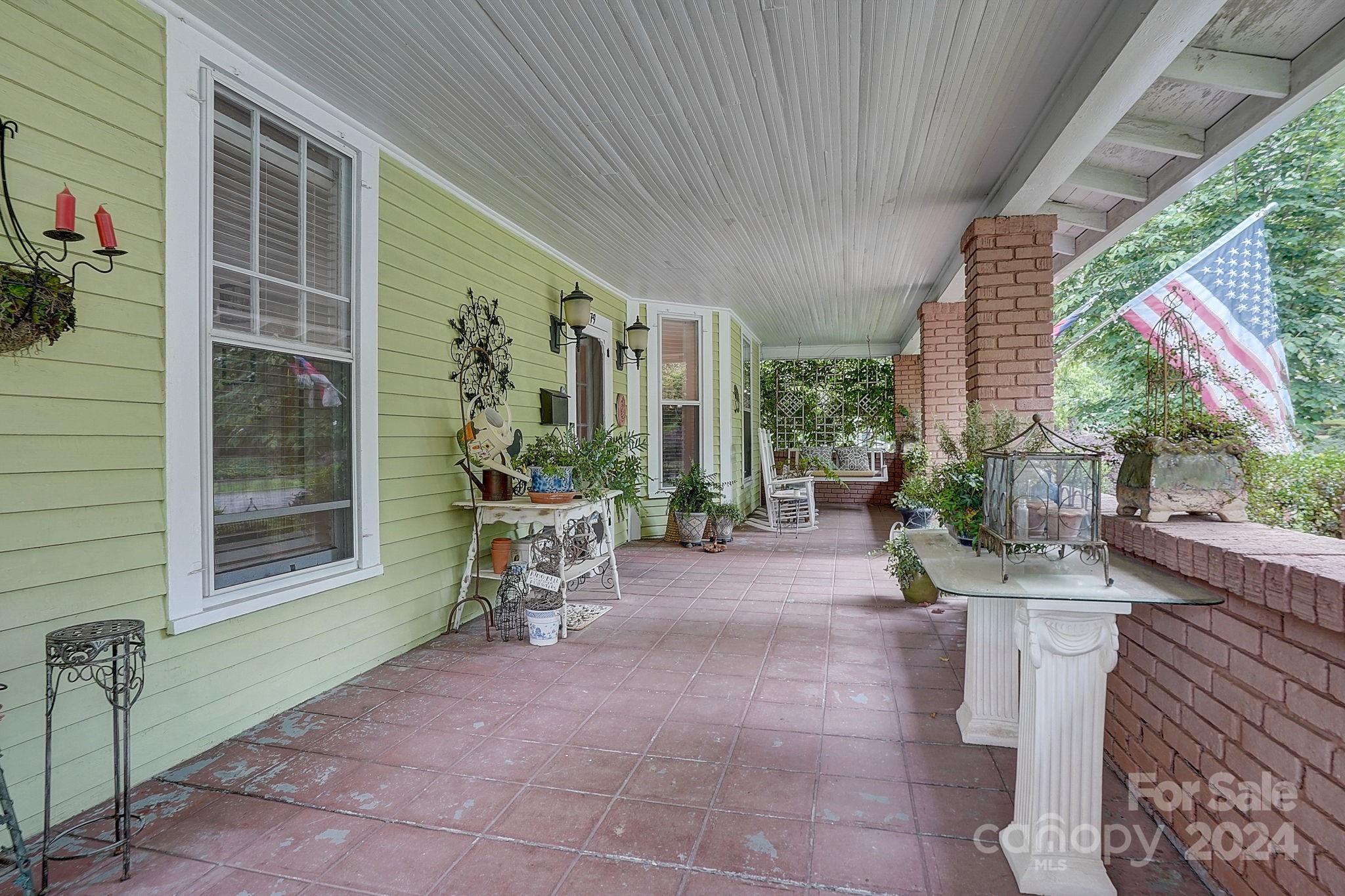 179 Union Street South Concord, NC 28025 - Photo 4 of 38 a view of a patio with table and chairs and potted plants