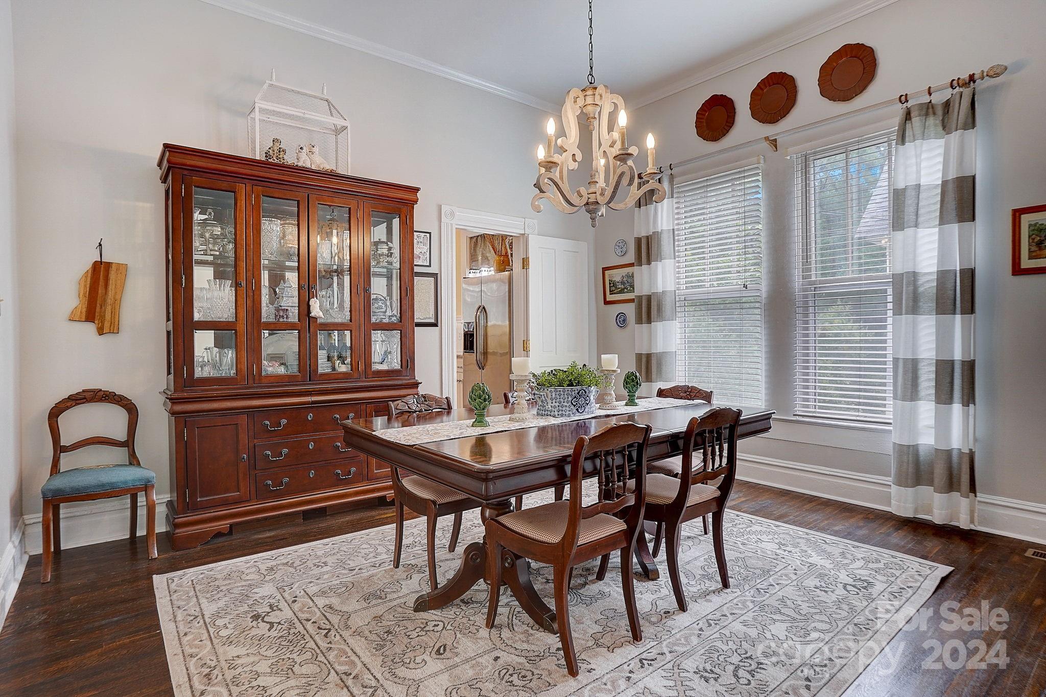 179 Union Street South Concord, NC 28025 - Photo 10 of 38 a view of a dining room with furniture and chandelier