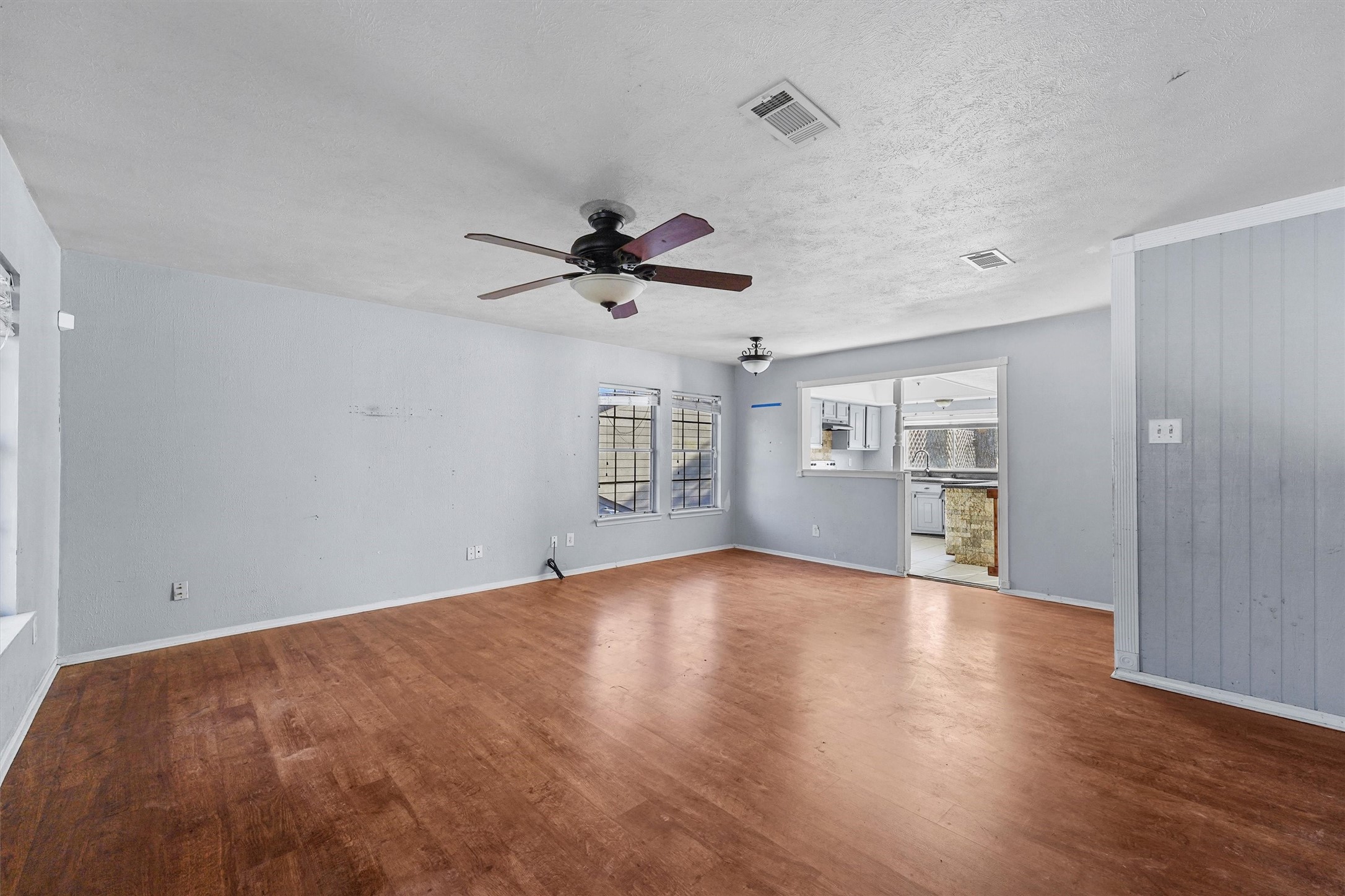 3218 Timberlark Street Houston, TX 77339 - Photo 11 of 28 a view of empty room with wooden floor and ceiling fan