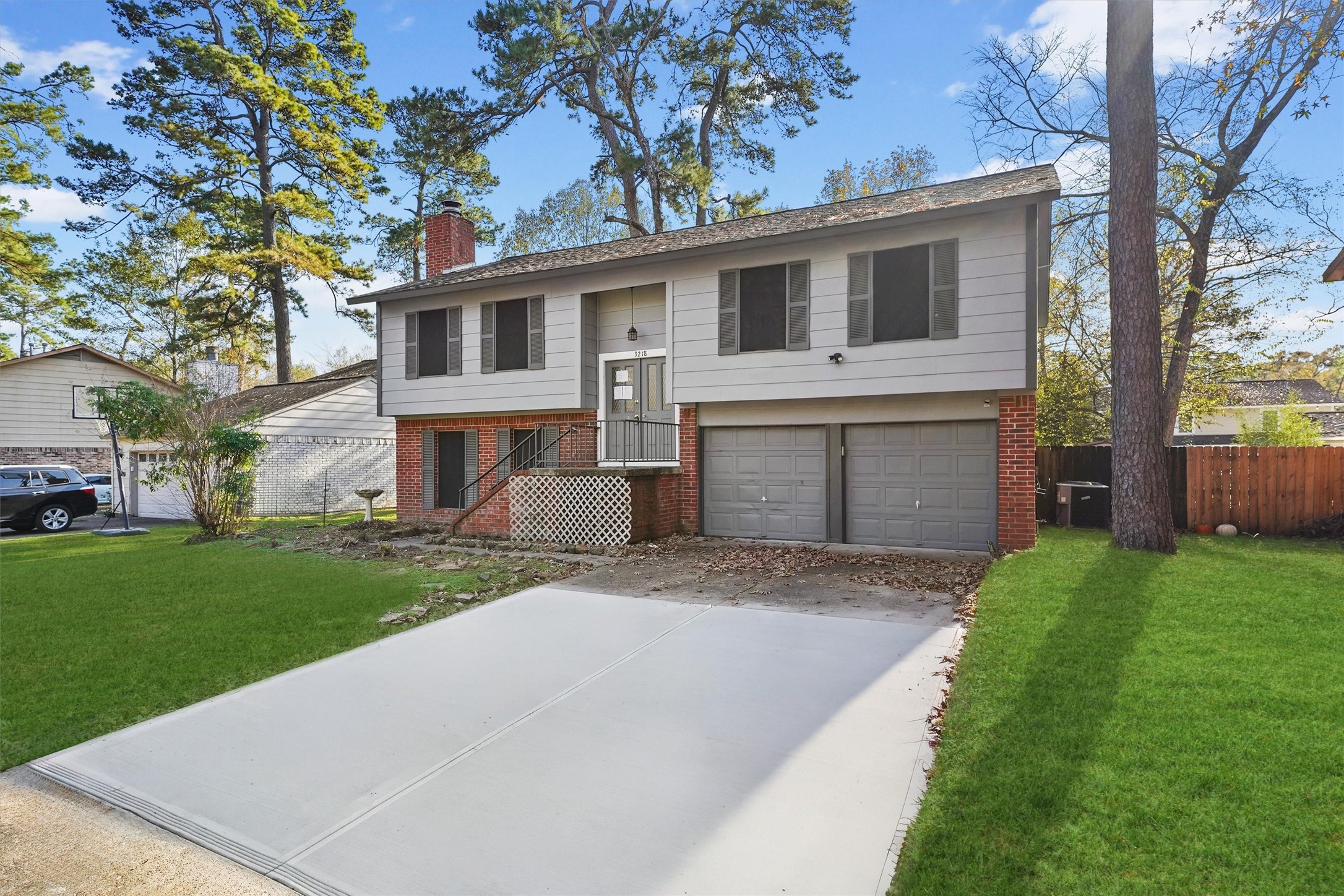 3218 Timberlark Street Houston, TX 77339 - Photo 2 of 28 a front view of a house with a yard and garage