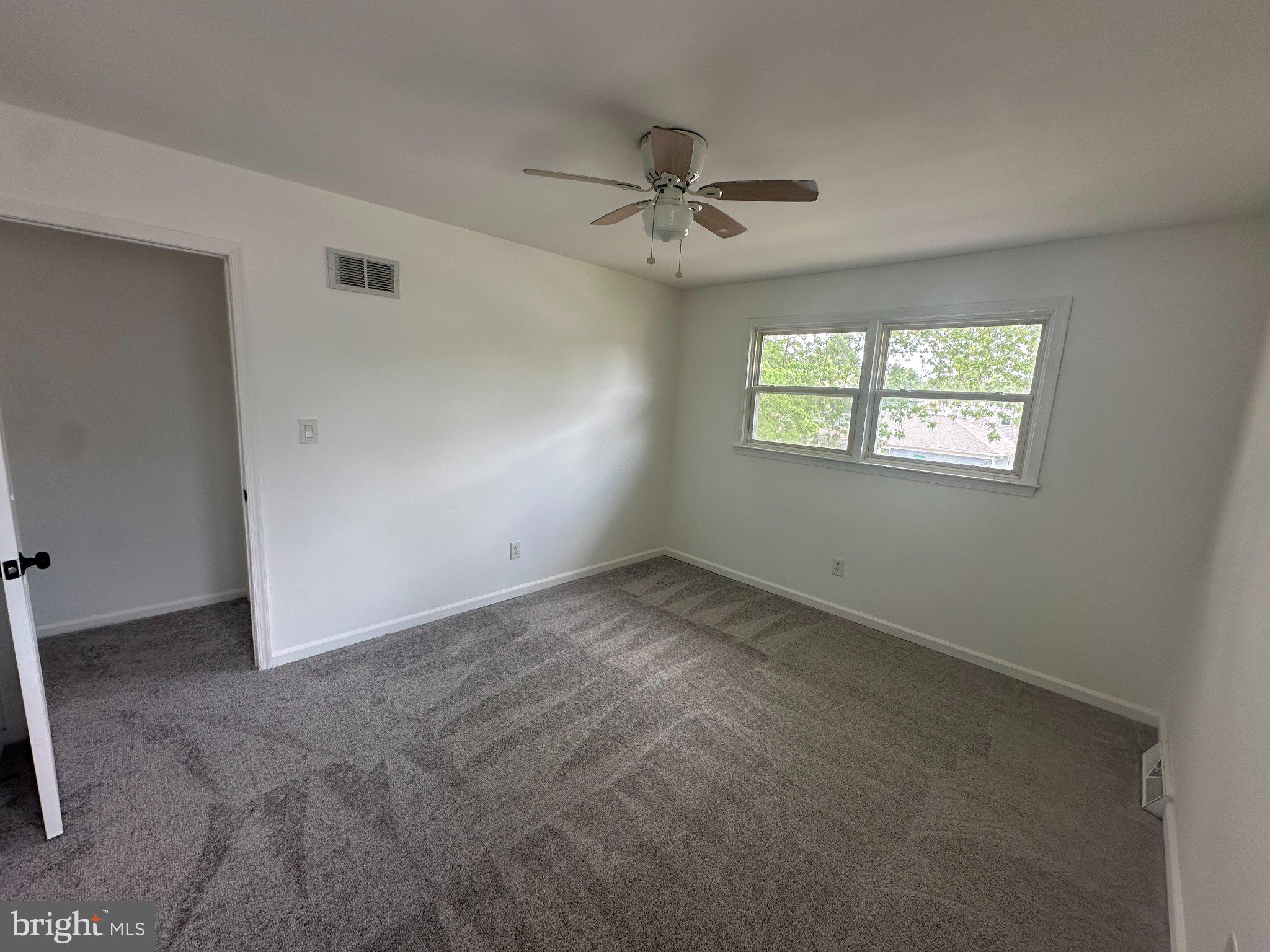 6 Travertine Way Newark, DE 19702 - Photo 20 of 22 a view of an empty room with a window