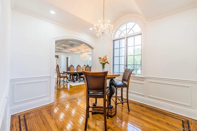 a living room with lots of furniture and a large window