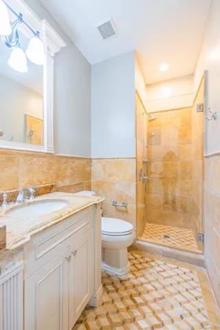 a dining room with furniture a chandelier and wooden floor