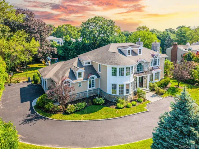 a view of a house with a garden and plants