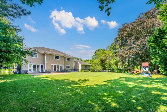 a house view with a sitting space and a garden