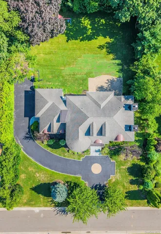 an aerial view of a house with a garden