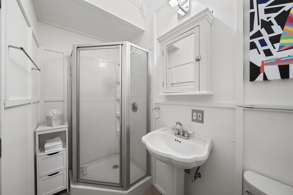 57 Warren Avenue, Unit 3 Boston, MA 02116 - Photo 21 of 24 a bathroom with a sink a toilet and shower
