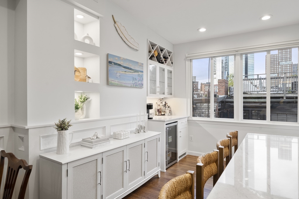 57 Warren Avenue, Unit 3 Boston, MA 02116 - Photo 7 of 24 a kitchen with a sink stove and cabinets