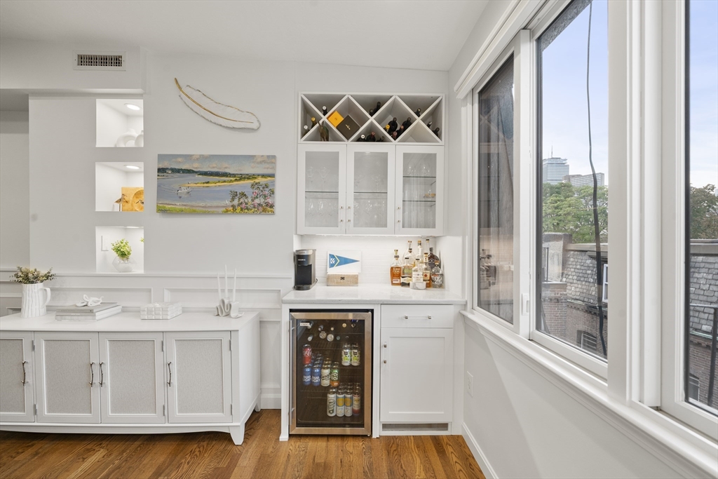57 Warren Avenue, Unit 3 Boston, MA 02116 - Photo 8 of 24 a kitchen with granite countertop a sink and a stove next to a window