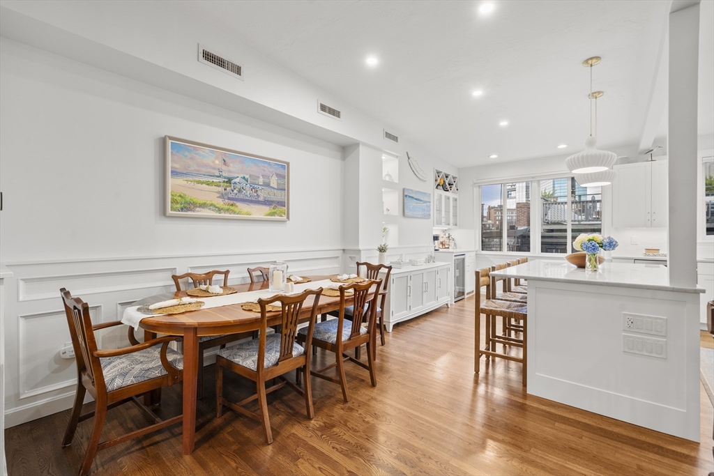 57 Warren Avenue, Unit 3 Boston, MA 02116 - Photo 9 of 24 a view of a dining room with furniture and wooden floor