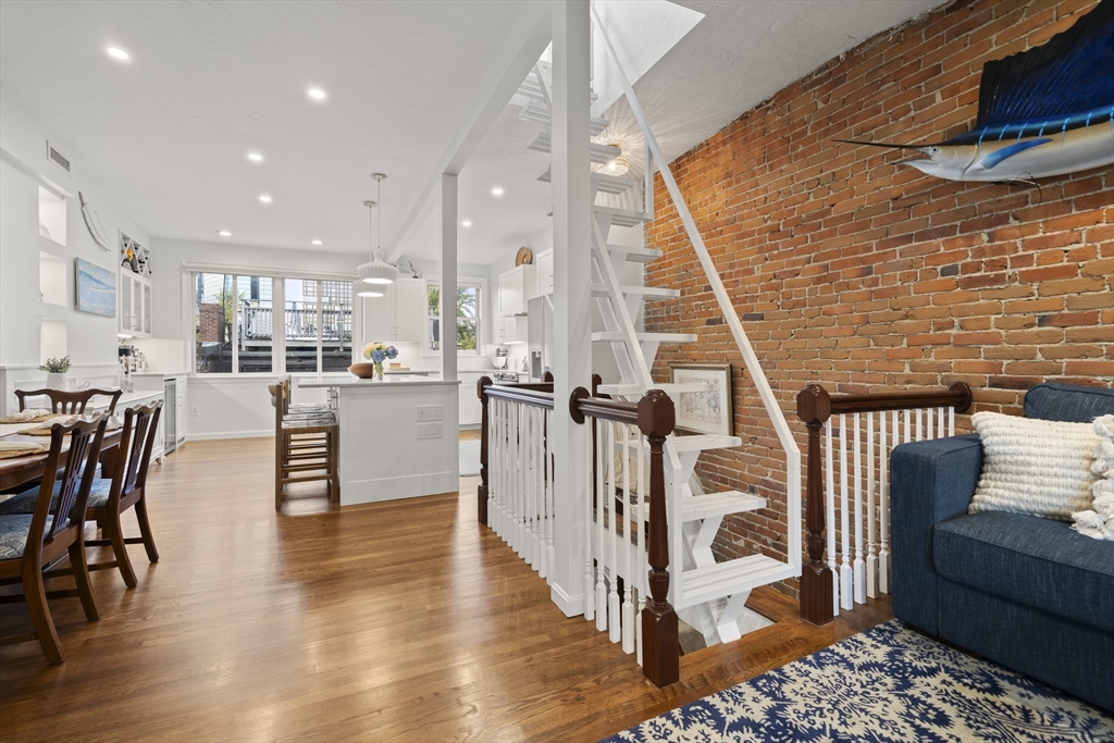 57 Warren Avenue, Unit 3 Boston, MA 02116 - Photo 10 of 24 a dining room with furniture and wooden floor