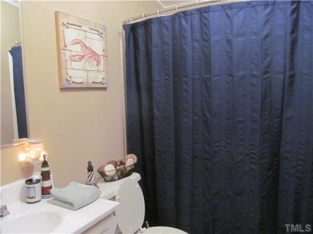 130 Dustin Lane Roxboro, NC 27574 - Photo 13 of 15 a bathroom with a sink and a mirror