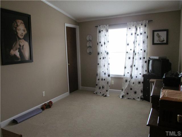 130 Dustin Lane Roxboro, NC 27574 - Photo 14 of 15 an empty room with windows