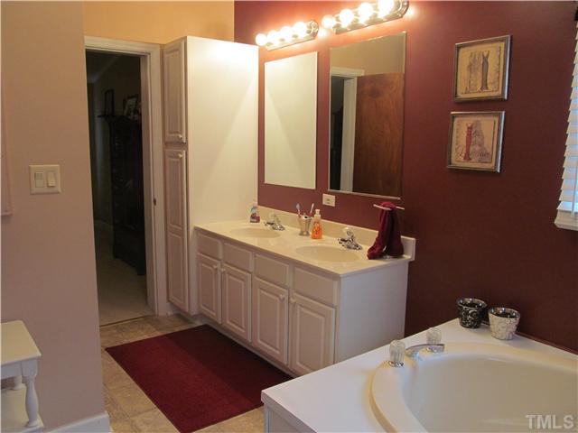 130 Dustin Lane Roxboro, NC 27574 - Photo 7 of 15 a bathroom with a double vanity sink and mirror