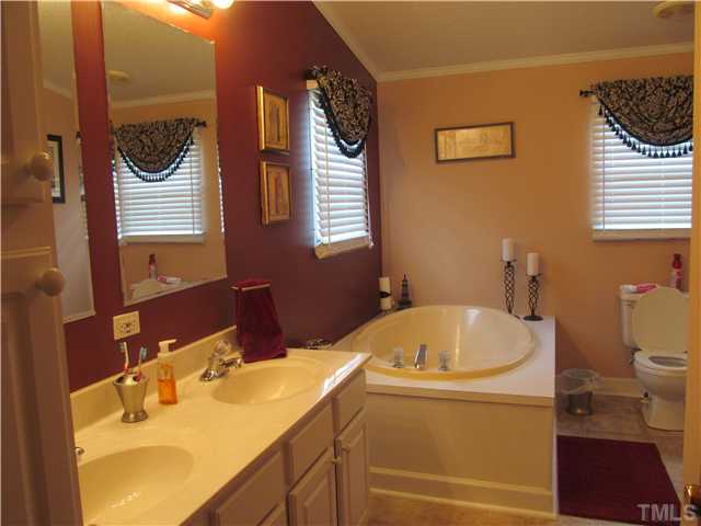 130 Dustin Lane Roxboro, NC 27574 - Photo 8 of 15 a bathroom with a sink and a toilet