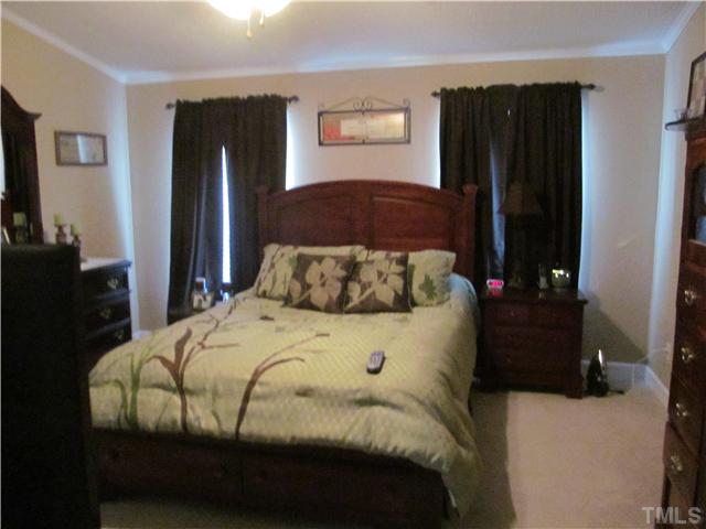 130 Dustin Lane Roxboro, NC 27574 - Photo 9 of 15 a bedroom with a bed and a closet