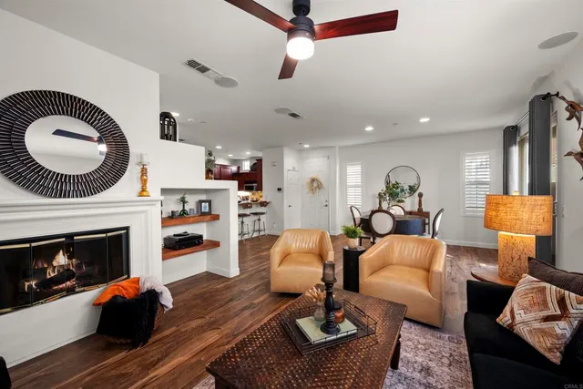 a dining room with furniture and wooden floor