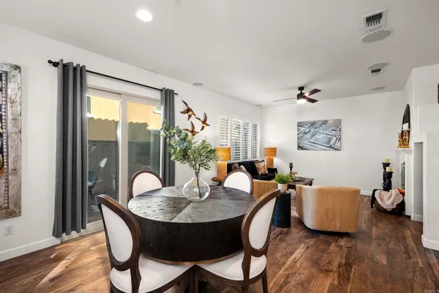 a front view of a house with outdoor seating