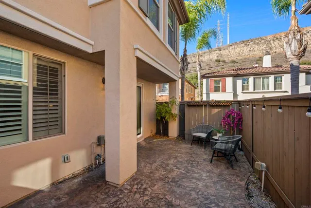 a view of a dining room with furniture and a mirror