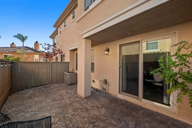 a kitchen with stainless steel appliances granite countertop a sink refrigerator and cabinets
