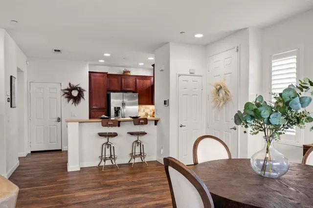 a kitchen with stainless steel appliances granite countertop a sink stove and microwave