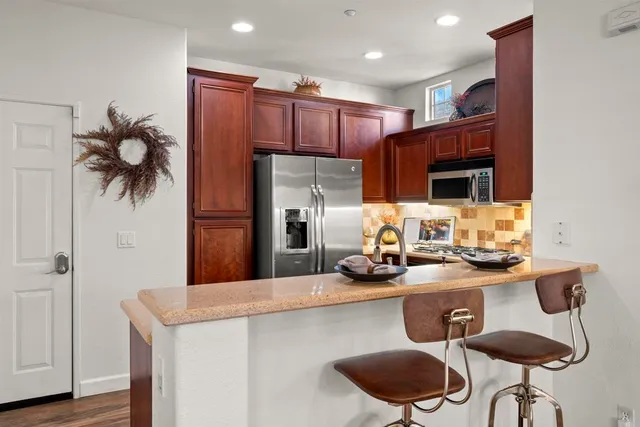 a kitchen with a sink a counter and cabinets