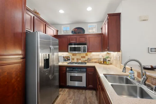 a bathroom with a double vanity sink mirror and double