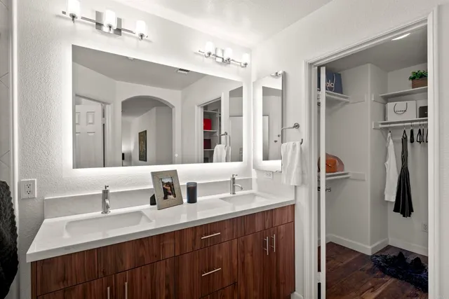 a view of a room with wooden floor
