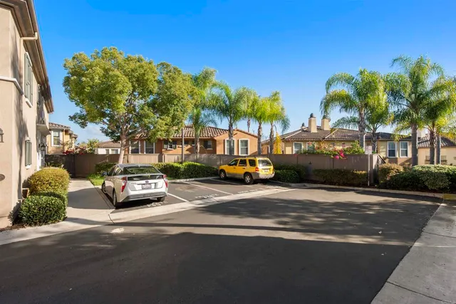 a view of a patio with table and chairs and potted plants