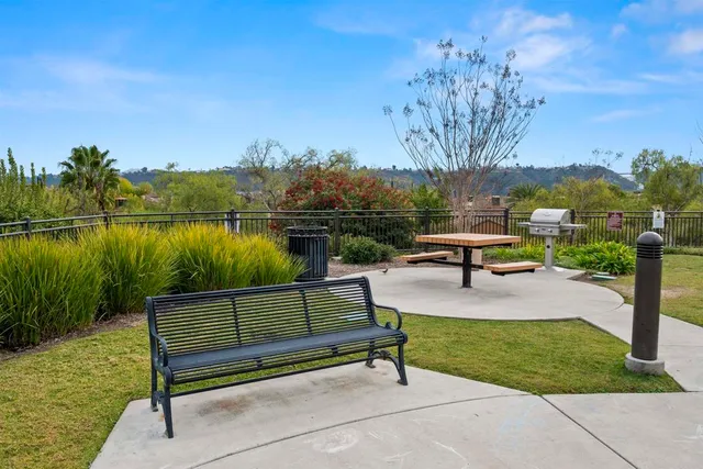 a view of living room with granite countertop furniture and floor to ceiling window