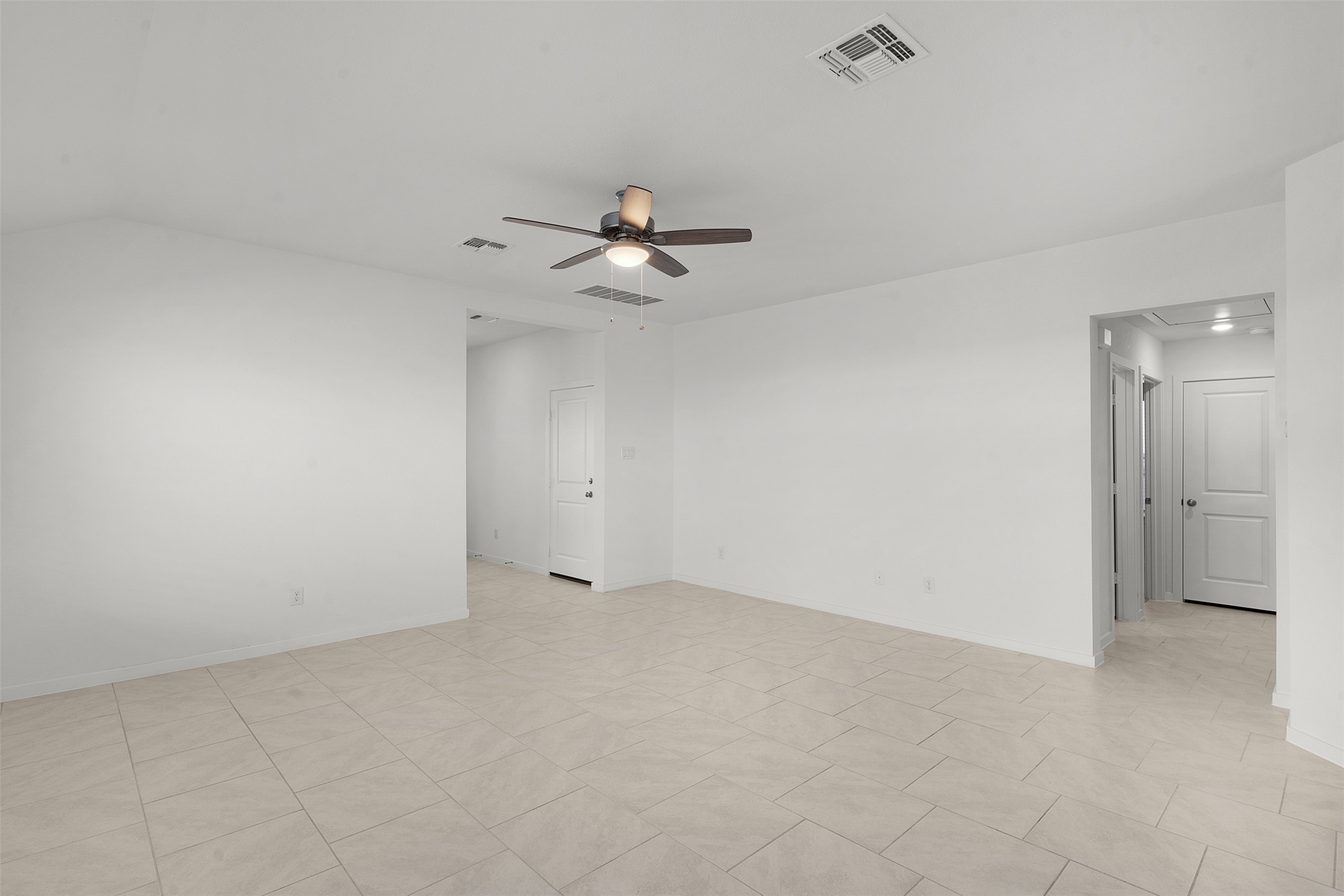 13832 Scarlett Song Drive Elgin, TX 78621 - Photo 14 of 26 Unfurnished room with a ceiling fan and attic access