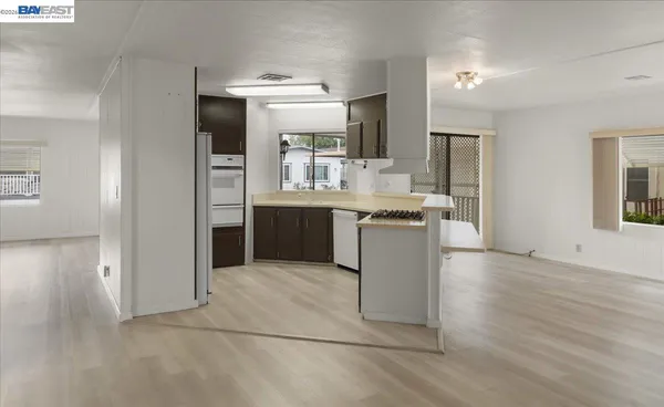 a kitchen with stainless steel appliances granite countertop a sink and cabinets