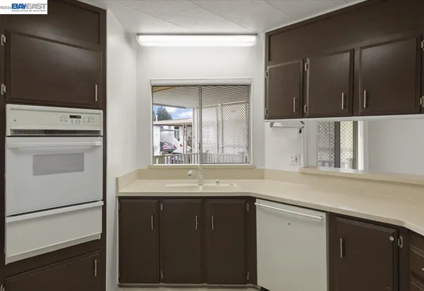 a kitchen with a cabinets and a stove top oven