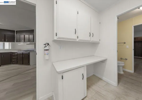 a view of storage and utility room with washer and dryer