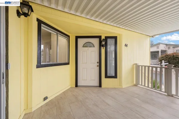 a view of a hallway with wooden walls