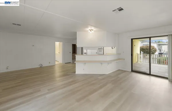 a view of a kitchen with a sink and a window