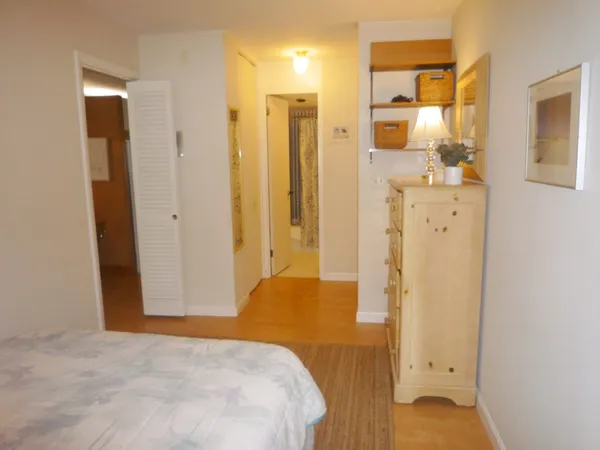 a bathroom with a shower sink and mirror