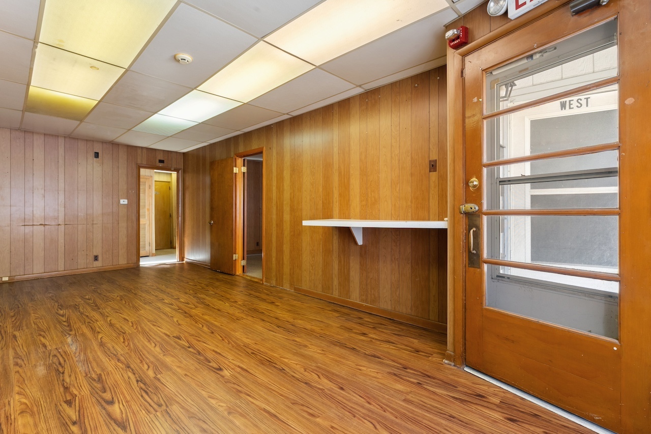 3701 216th Street Matteson, IL 60443 - Photo 13 of 26 a view of an empty room with wooden floor and a window