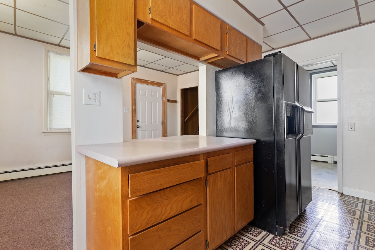 3701 216th Street Matteson, IL 60443 - Photo 17 of 26 a kitchen with a refrigerator and countertop