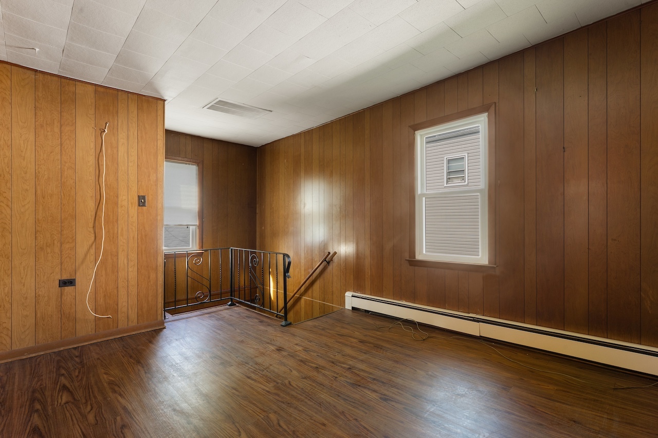 3701 216th Street Matteson, IL 60443 - Photo 18 of 26 an empty room with wooden floor and windows